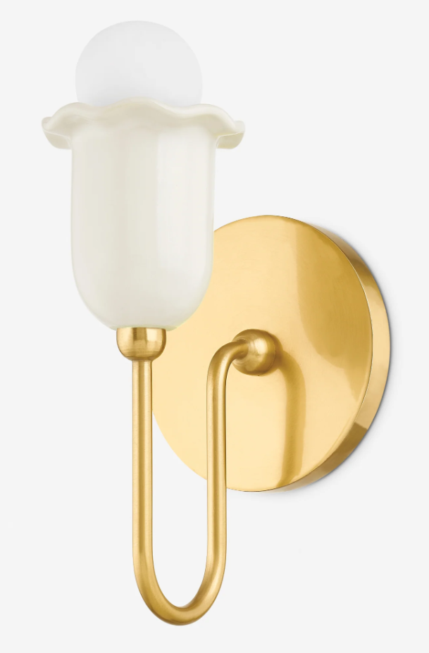 A gold wall sconce with a frosted glass shade and a U-shaped brass arm, mounted on a white background. The polished round backplate and softly diffused light give the fixture a refined, modern look for AI in my design work. Home Design, Rendering, Annilee Waterman, Dallas Texas